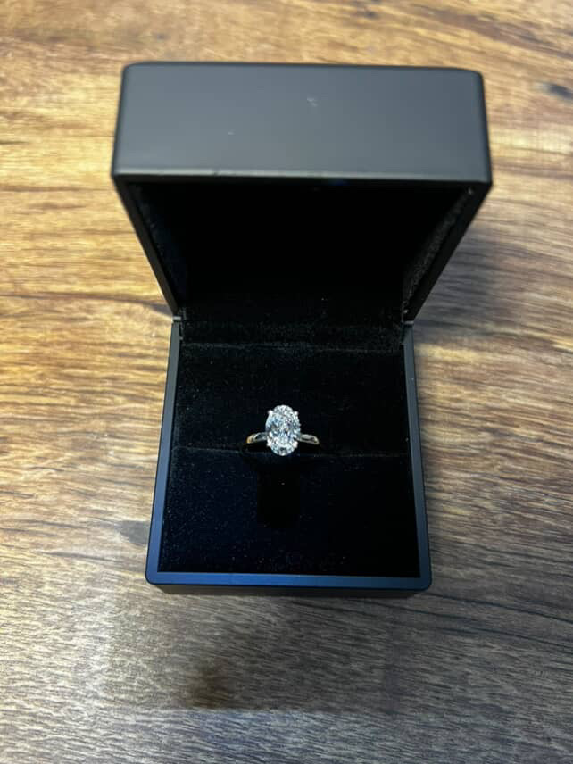 Oval diamond solitaire engagement ring in luxury box
