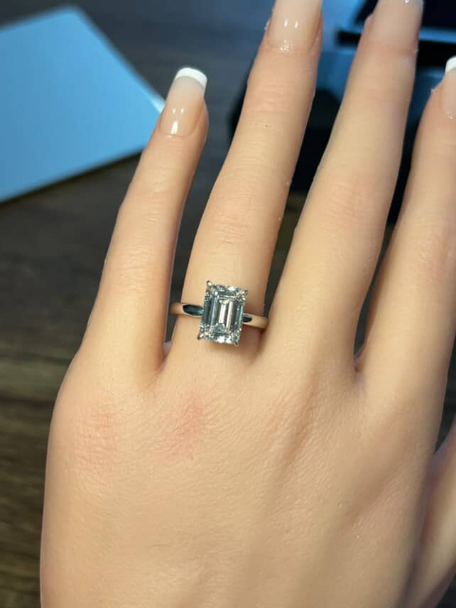 Emerald cut solitaire engagement ring